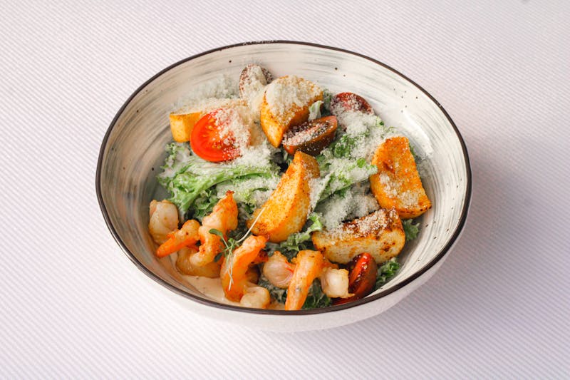 Fresh Caesar salad with croutons and parmesan