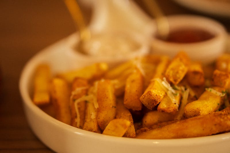 Crispy seasoned fries with dipping sauce