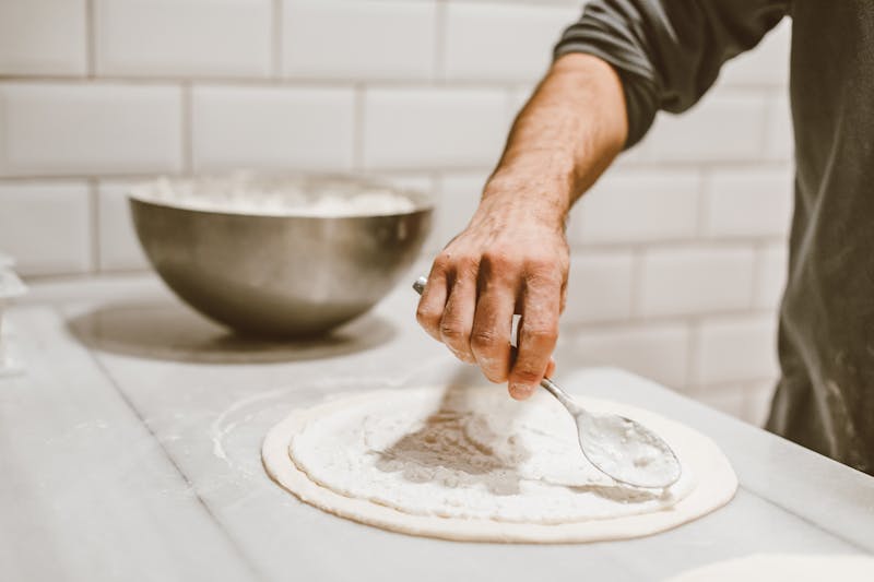 Via 313 team preparing Detroit-style pizza dough